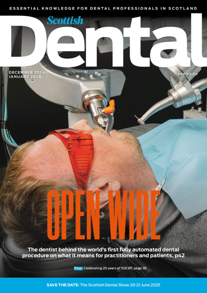 Open Wide: The cover of this month's issue with an image of a patient being treated by a robotic dentist.