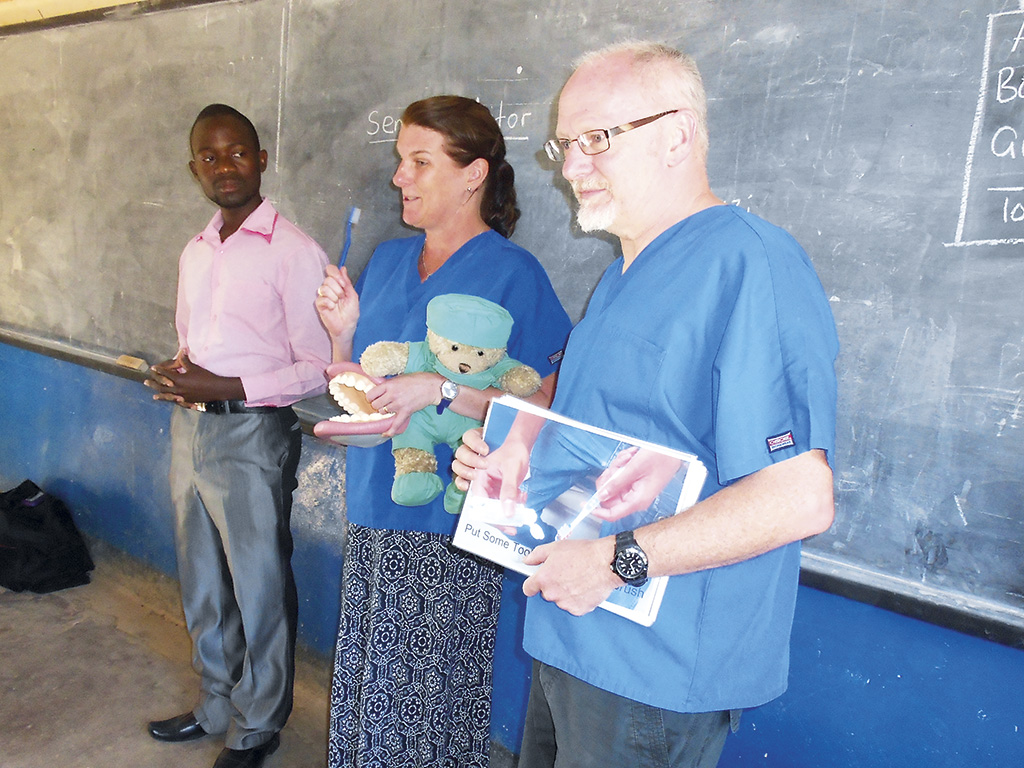 Vicky and Nigel Milne talk at a Malawian school