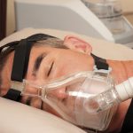 Continuous positive airway pressure (CPAP) machine in use