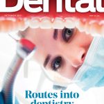 Routes into dentistry - the October 2021 cover is a female dentist holding a handpiece looking into an open mouth