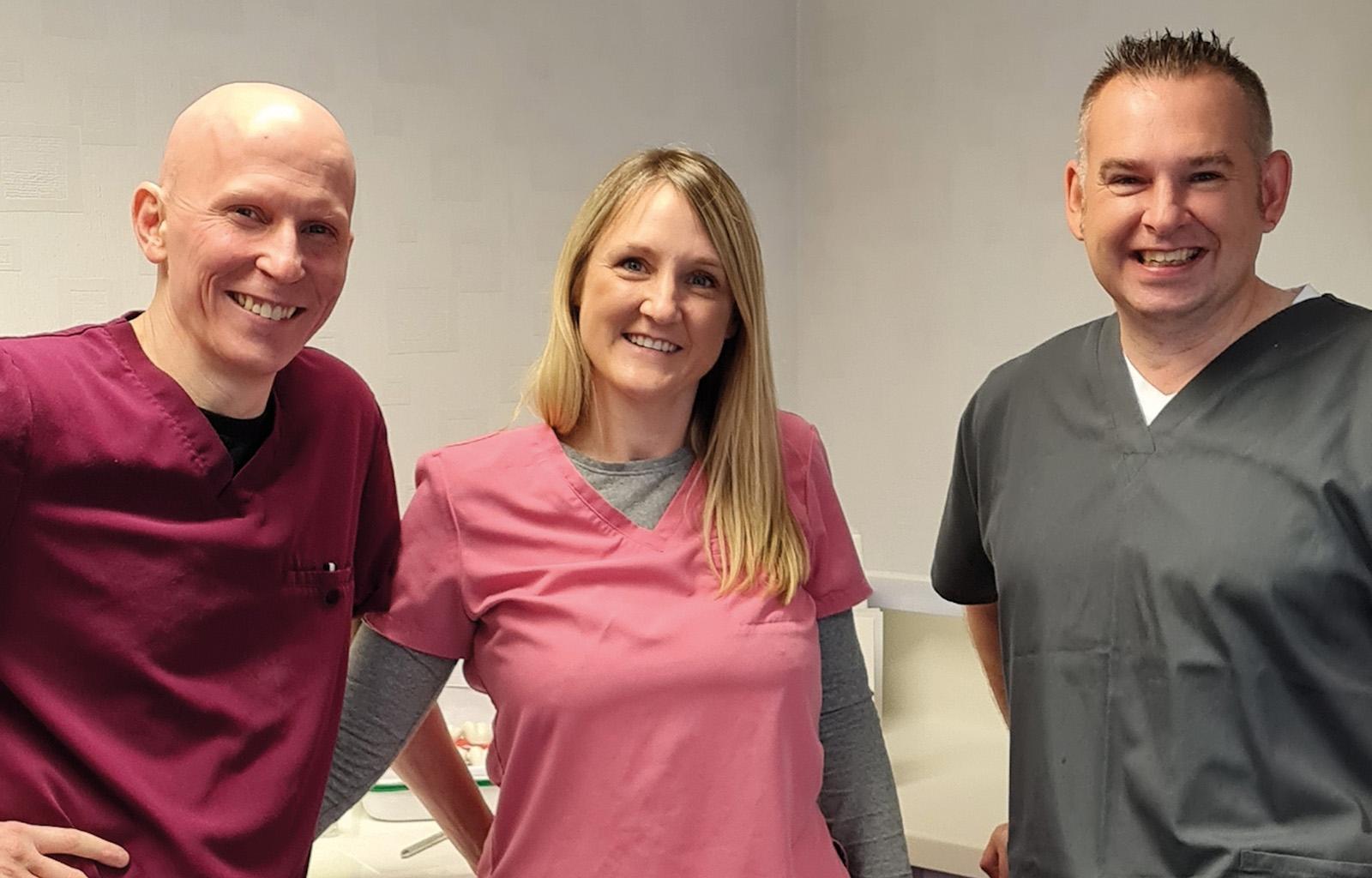 John Wall, general practitioner with a specialist interest in implants, with Emma and Kenneth Kendall