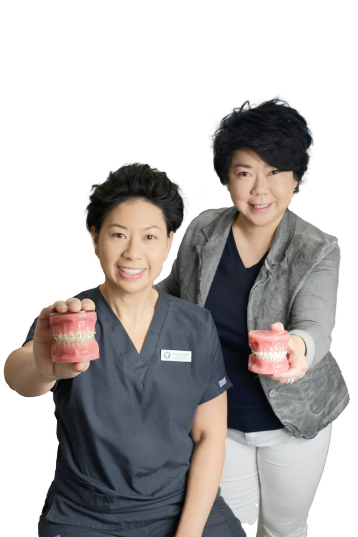 Lisa and Ivin hold up models of braces in place.