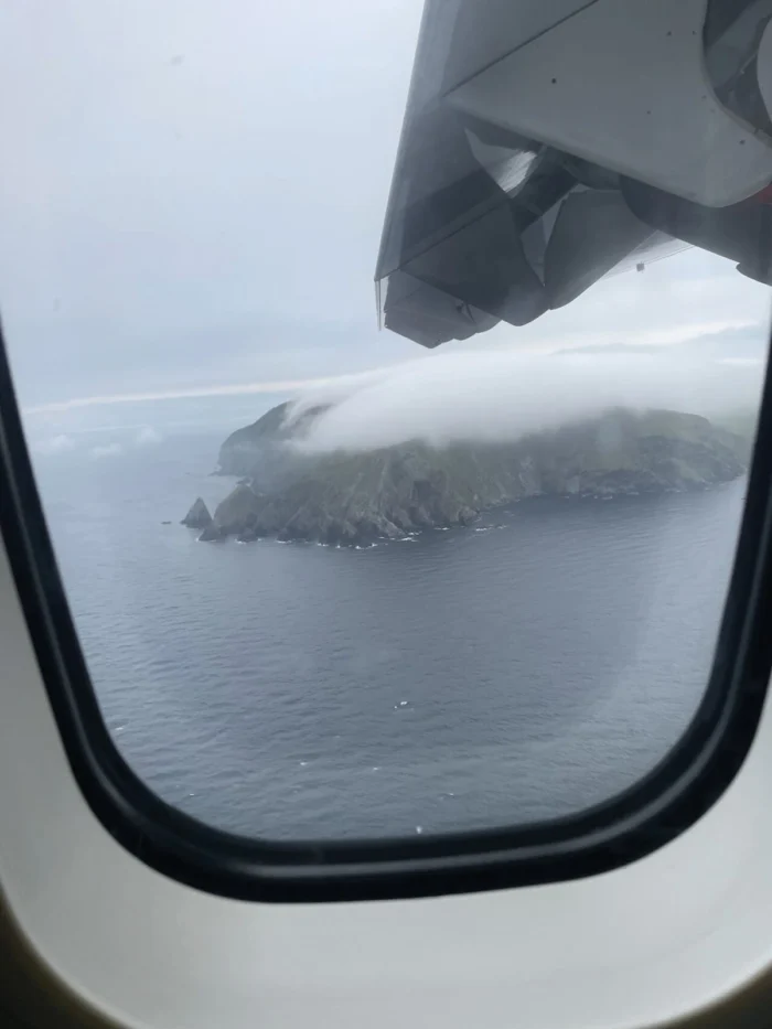 A look out of a cabin window at a cold Shetland Island