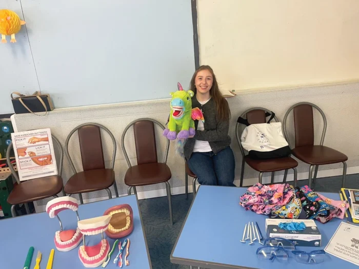 Rachel McLeod shows off a unicorn puppet